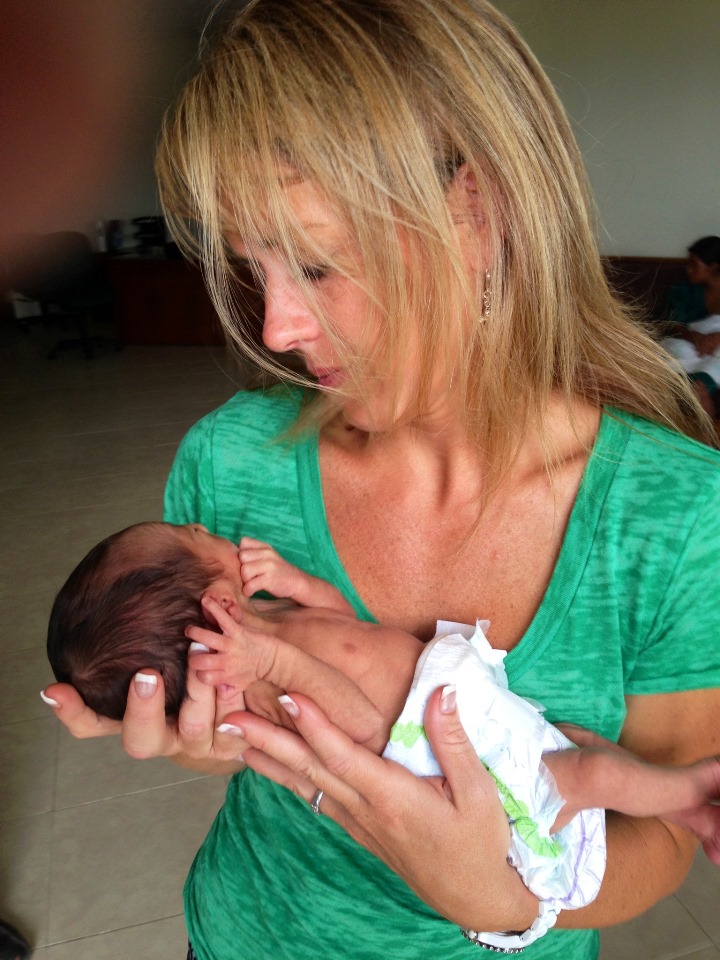 Shae Billingsley at Baby Rescue center with 8 day old baby whose life we saved