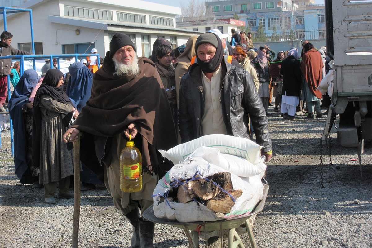 Afghan refugees receive emergency aid like firewood